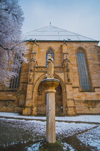cathedral and statue of Mary in winter 