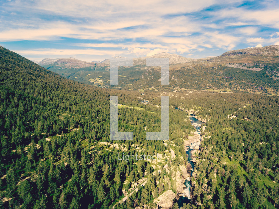 aerial view over mountain rivers and forest 
