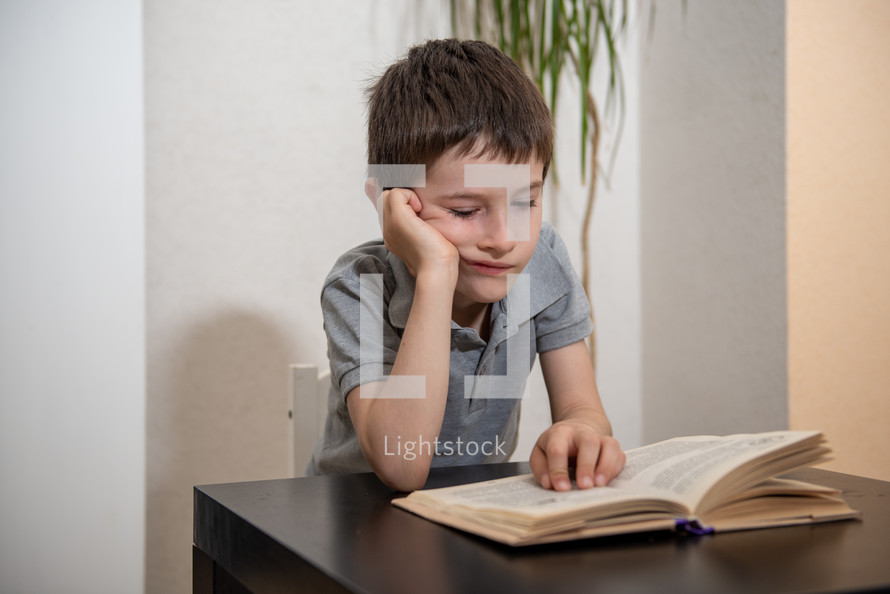 boy reading a book 