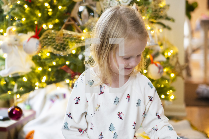 Little girl in front of Christmas tree