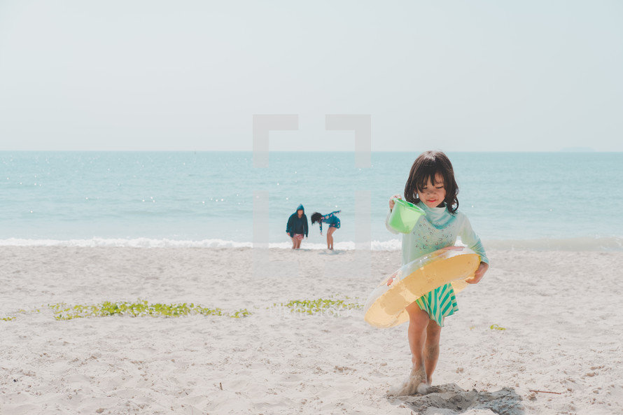 girl playing on a beach 