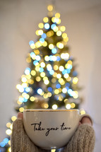 "Take Your Time" mug in front of a Christmas tree