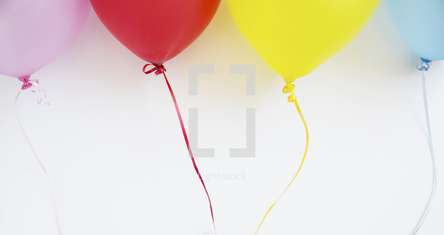 colorful balloons on string 