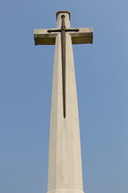 Christian cross and sword at war memorial graveyard 