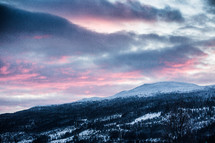 pink sky over a snowy mountain 