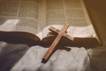 cross on an open Bible 