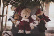 Teddy bears under a Christmas tree