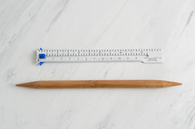 ruler and wooden pick 
