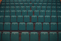 rows of empty seats in an auditorium 