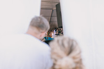 peeking into a tent with a worship service inside 