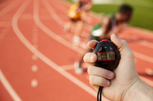 timing a race with a stopwatch 