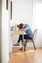 exhausted woman at a desk 