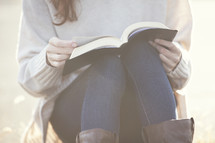 Girl reading a Bible 