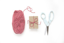 scissors, yarn, and gift box