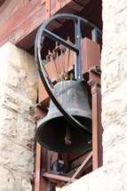 Bell in a stone bell tower.
