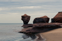 rock formations and rocks along a shoreline 