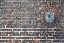 circular window in a brick wall 