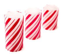 red and white candy cane striped candles 