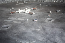 Model of craters and space equipment.