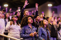 A congregation of young people at a worship service.