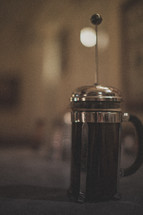 A French press brewing coffee