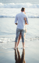 a couple hugging on a beach
