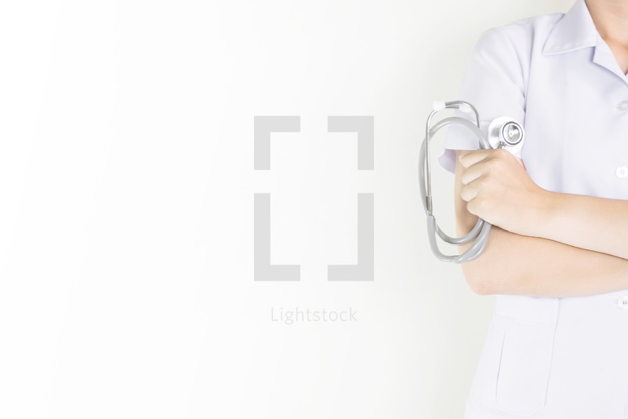 healthcare worker holding a stethoscope 