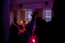 raised hand during a worship service 