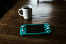 coffee and handheld video game device 