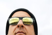 man in a wool cap and sunglasses 