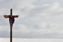 Veiled cross by the ocean.