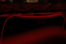 Rows of seating in a theatre or cinema, red chair