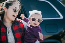 mother and infant in sunglasses 