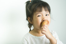 child eating an ice cream cone 
