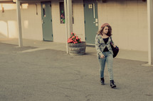 Young Teenage girl walking alone on a school campus, sad, loneliness, student, youth