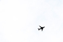 silhouette of an airplane in flight 