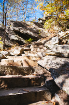 steps cut into rock along a trail 