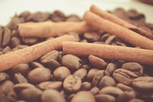 cinnamon sticks on coffee beans 