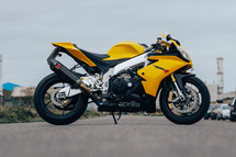Aprilia RSV4 sports motorbike, superbike motorcycle, yellow racing colours