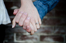 closeup of a couple holding hands 