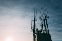 communication towers on a rooftop 