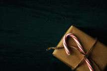 wrapped gift with candy cane