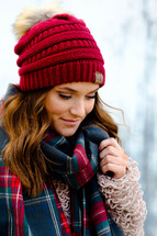 a young woman in a plaid scarf 