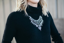 woman wearing a jeweled necklace 