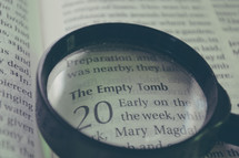 magnifying glass focused on the bible