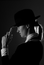 Black and white photo of the businesswoman in hat