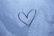 heart shape drawn in ice.