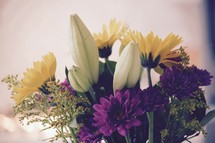 white, purple, yellow, flower arrangement 