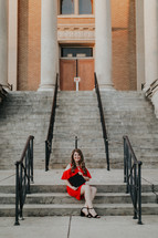 graduate in a red dress 