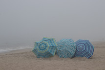 umbrellas on a beach in the sand 
